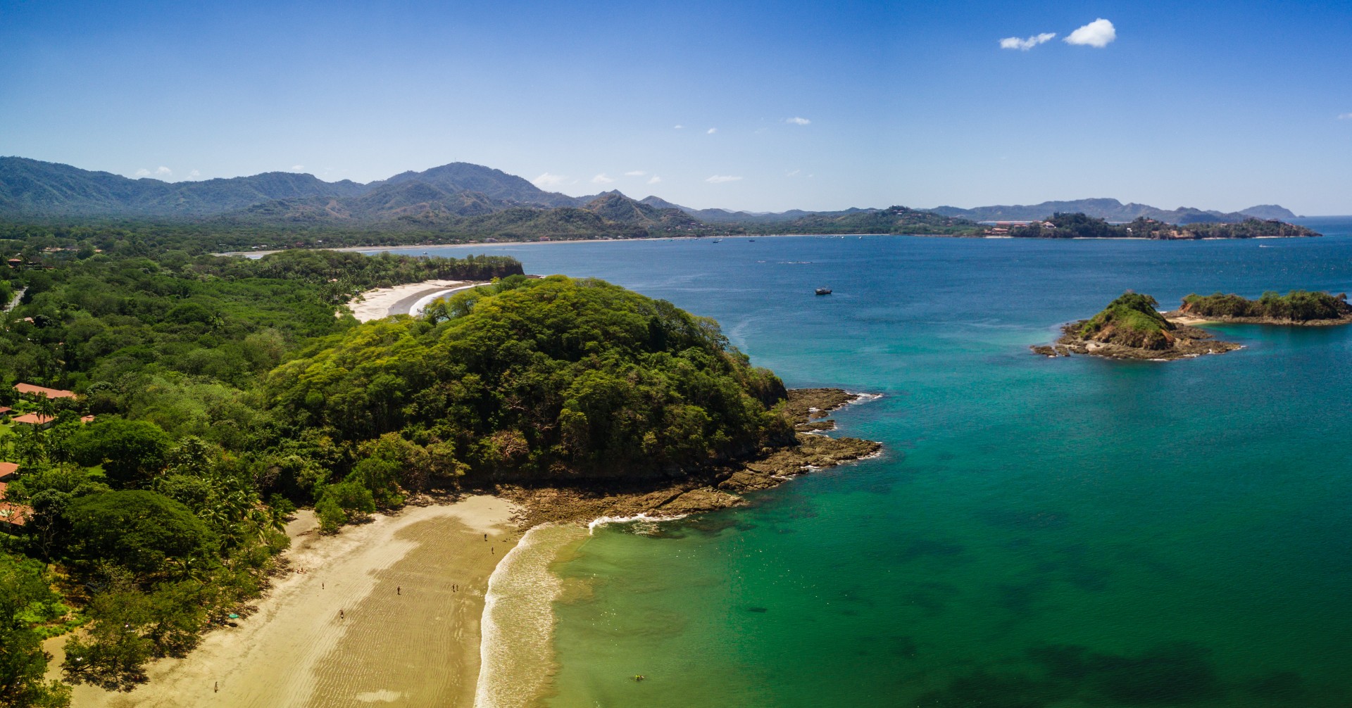 Aerial drone photo of the Pacific Ocean meeting the beaches & rainforest Costa Rica
