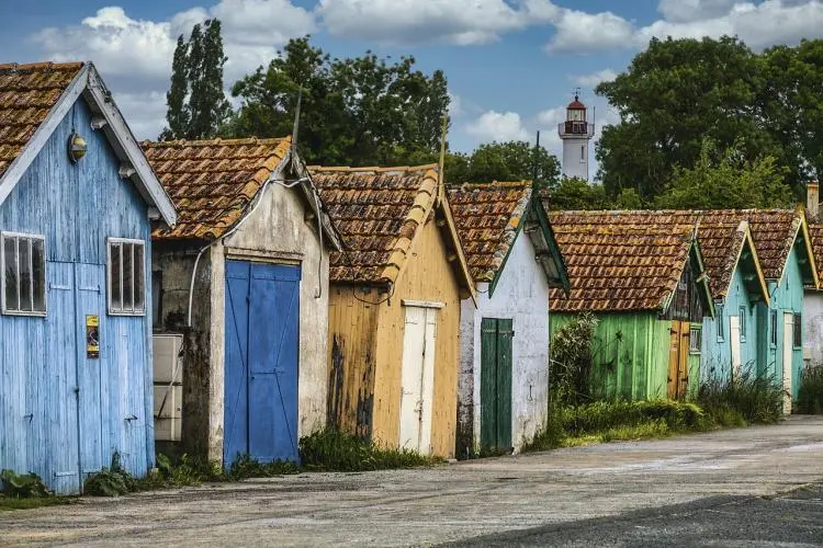 Colorful fishing huts in France featured