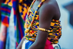 A girl dressed in a traditional outfit in ashanti culture during a cultural journey