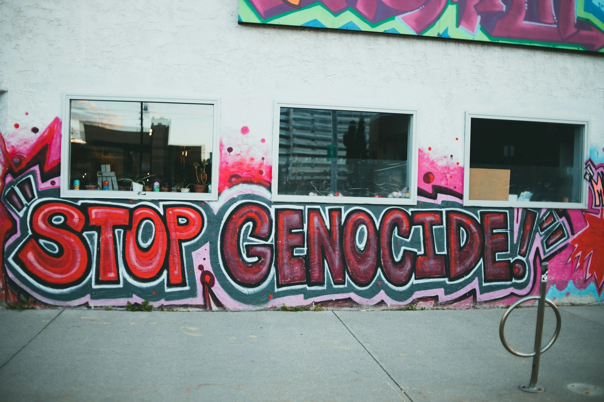 Graffiti painting of stop genocide in rwanda for a destination guide