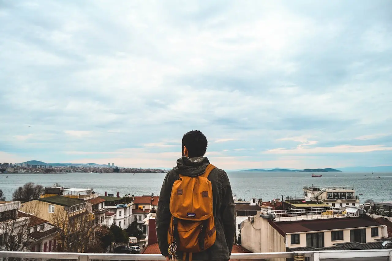 A guy looking out over bosphorus strait in istanbul