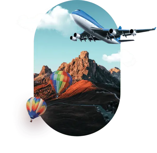 Mountainous landscape with two colorful hot air balloons floating below featured on LABUSA Travel.