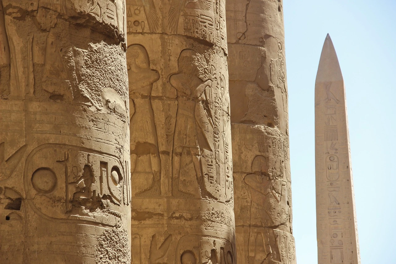 Ancient Egyptian hieroglyphs and pictorial markings carved into stone, a key feature of Egypt's cultural heritage sites