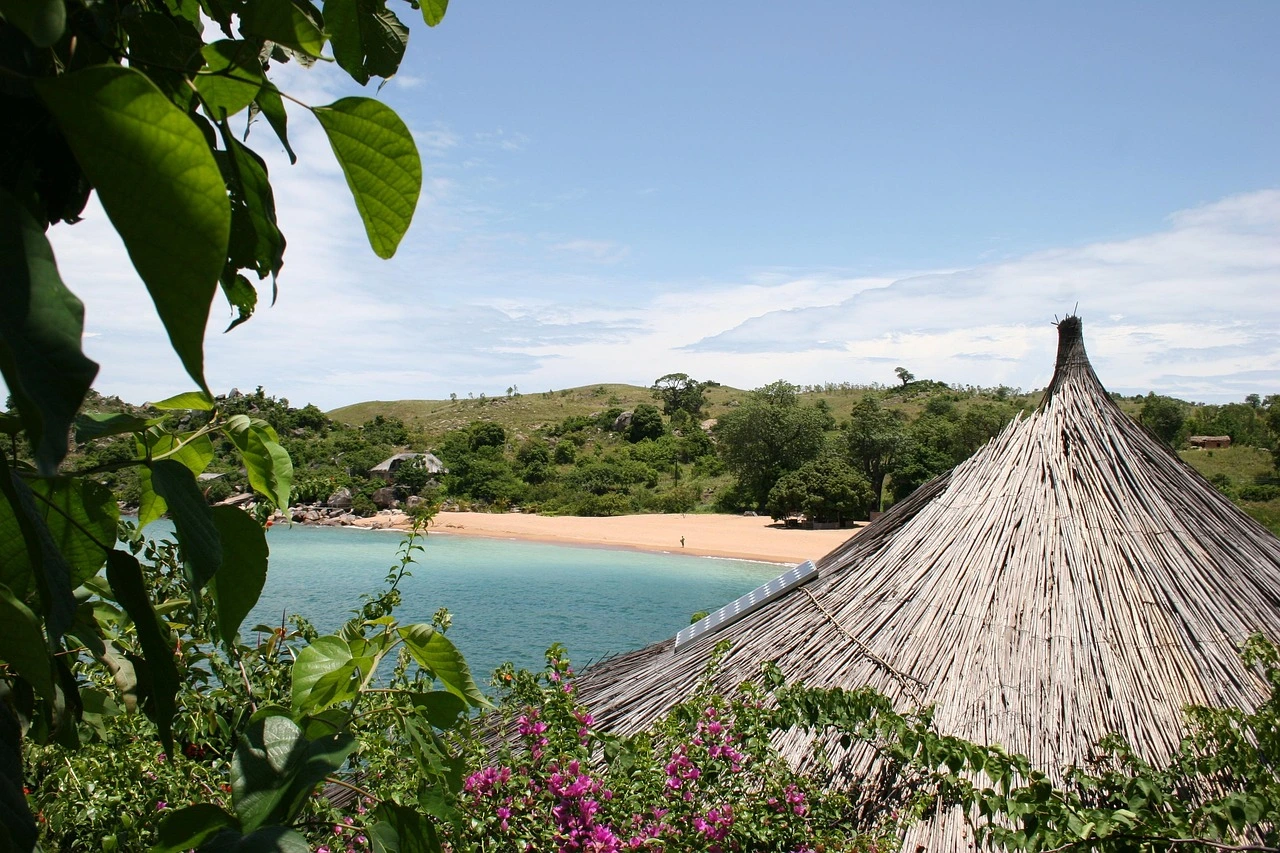 A thatched-roof hut on a beach