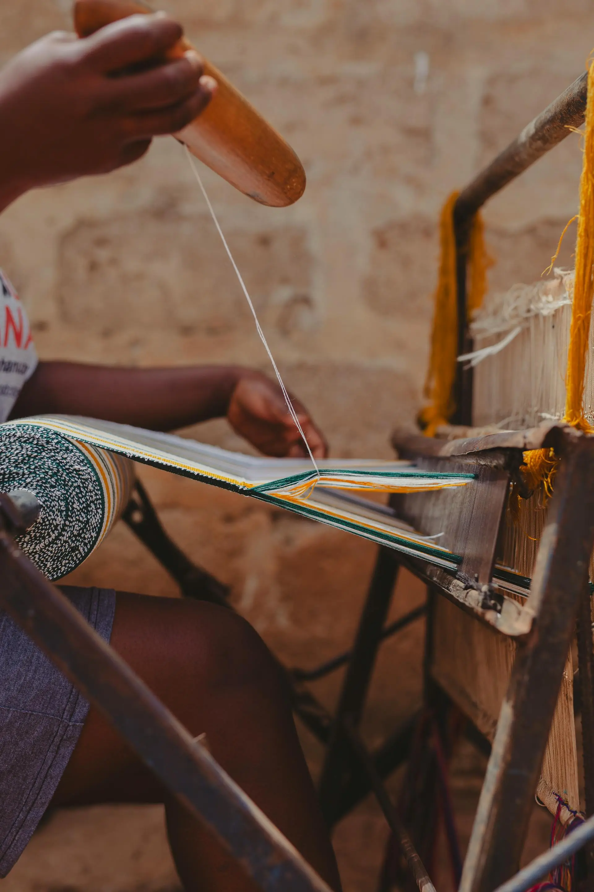 Traditional Kente weaving in Kumasi, Ghana, representing Ashanti culture and heritage on Ghana cultural tours