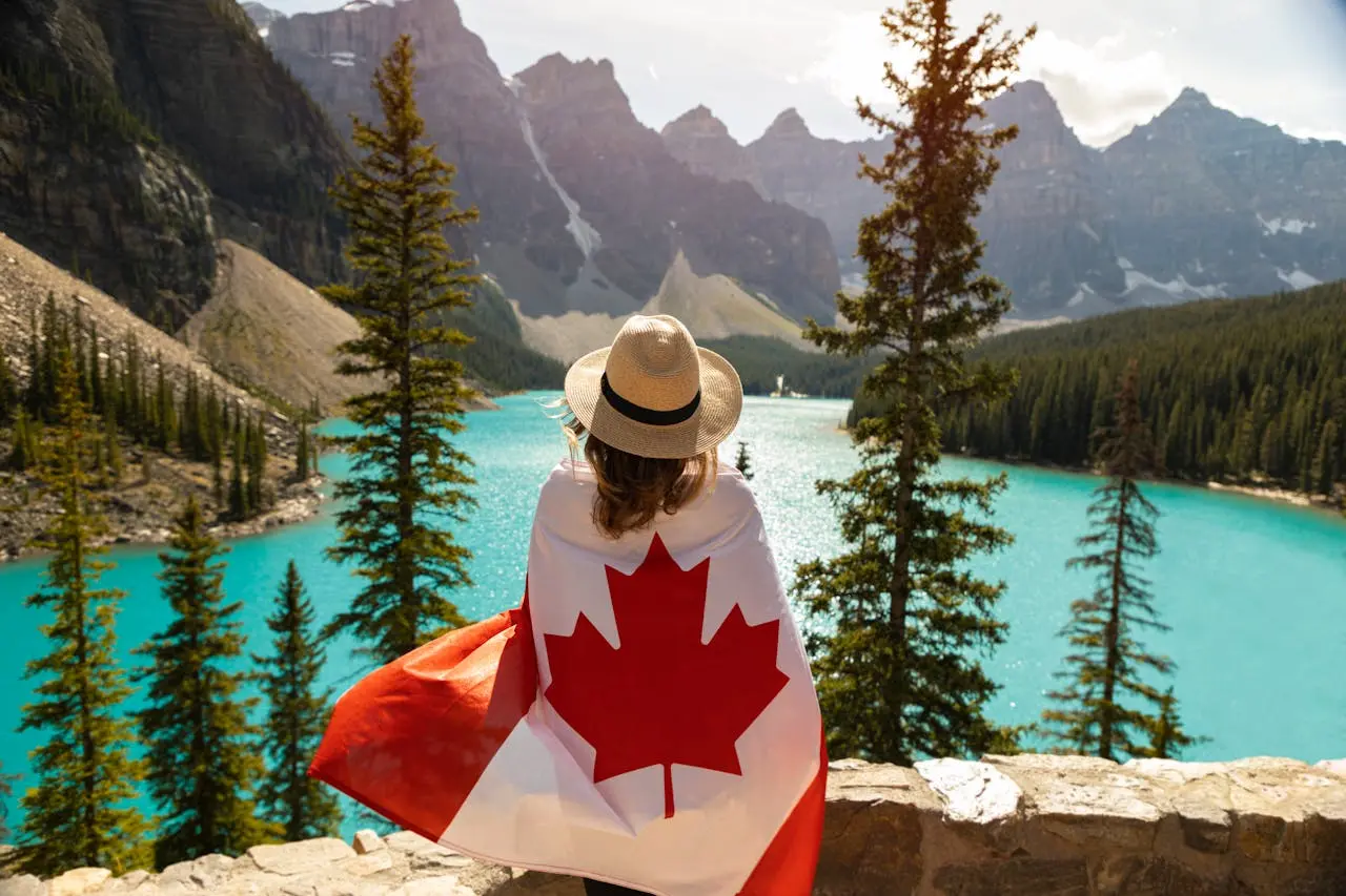Woman draped in a flag of canada featured