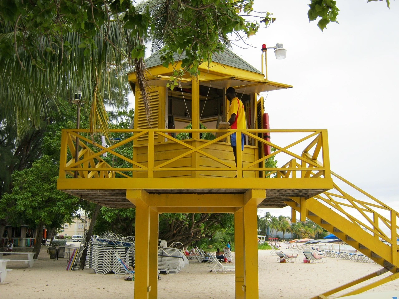 Yellow lifeguard tower on a beach in Barbados featured