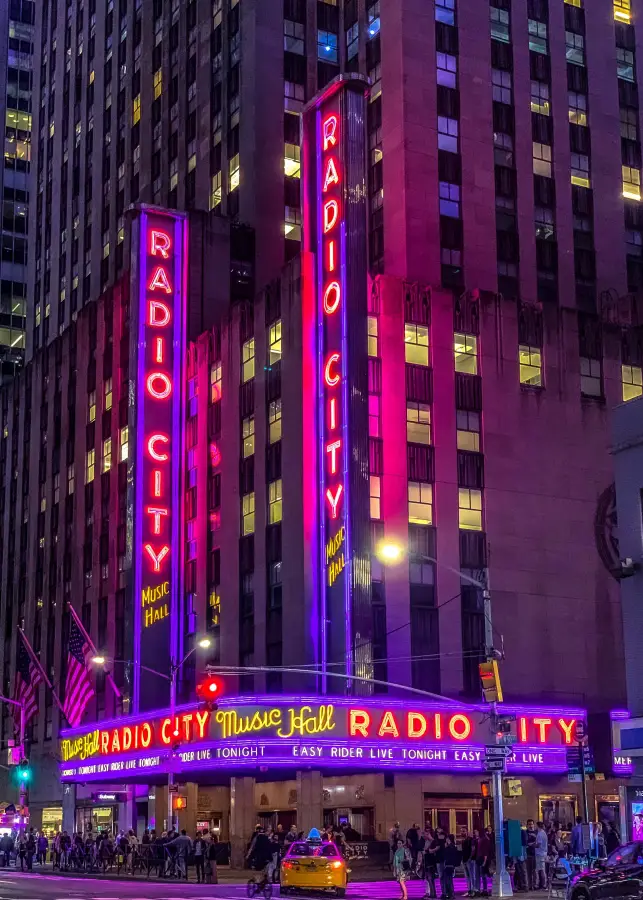 Radio City Music Hall glowing neon marquee at night in New York New York advertising Easy Rider Live Tonight