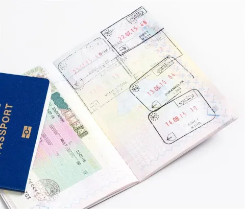 a passport with pages with visas and stamps