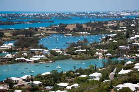 White stepped roofs and moored boats around the turquoise inlets of Bermuda's Great Sound.