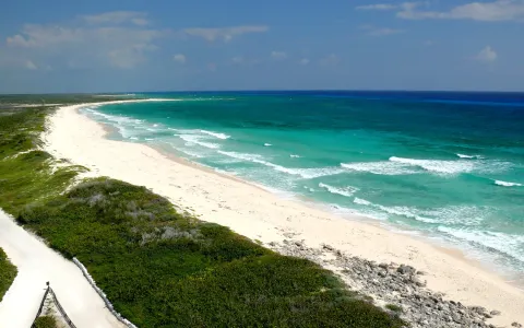The undeveloped windward beach curving north from Punta Sur on Cozumel.