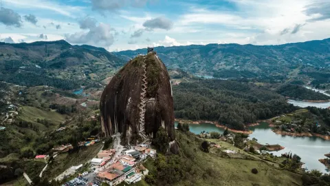 The Piedra del Penol rising above the green islands of the Guatape reservoir in Antioquia, Colombia, stairway on the rock