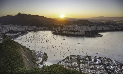 Botafogo Bay in Rio de Janeiro at sunset from Sugarloaf Mountain, its marina full of moored yachts below the city ridges