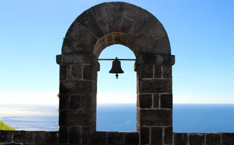 The bell arch on the ramparts of Brimstone Hill Fortress above the sea.