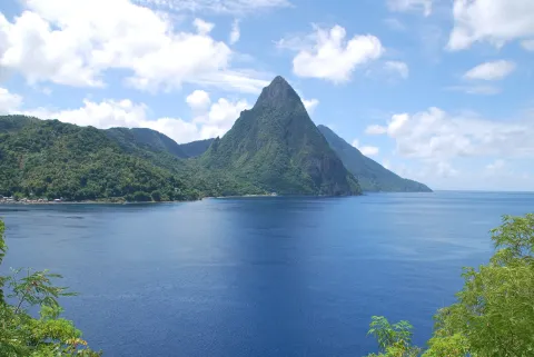 Petit Piton rising from the forested shore of Soufriere Bay in Saint Lucia.