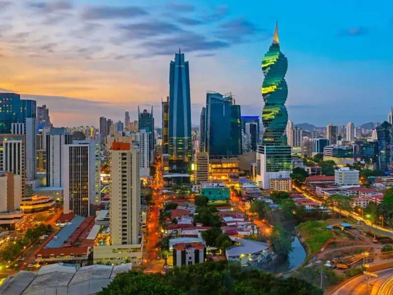 The colorful panoramic skyline of Panama City at sunset with high rise skyscrapers, Panama, Central America