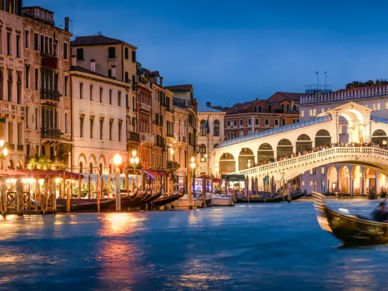 Romantic gondola ride near Rialto Bridge in Venice, Italy