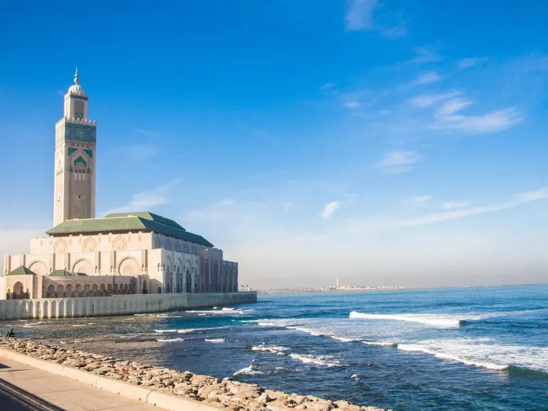 The Hassan II Mosque and its minaret standing on the Atlantic shore at Casablanca.