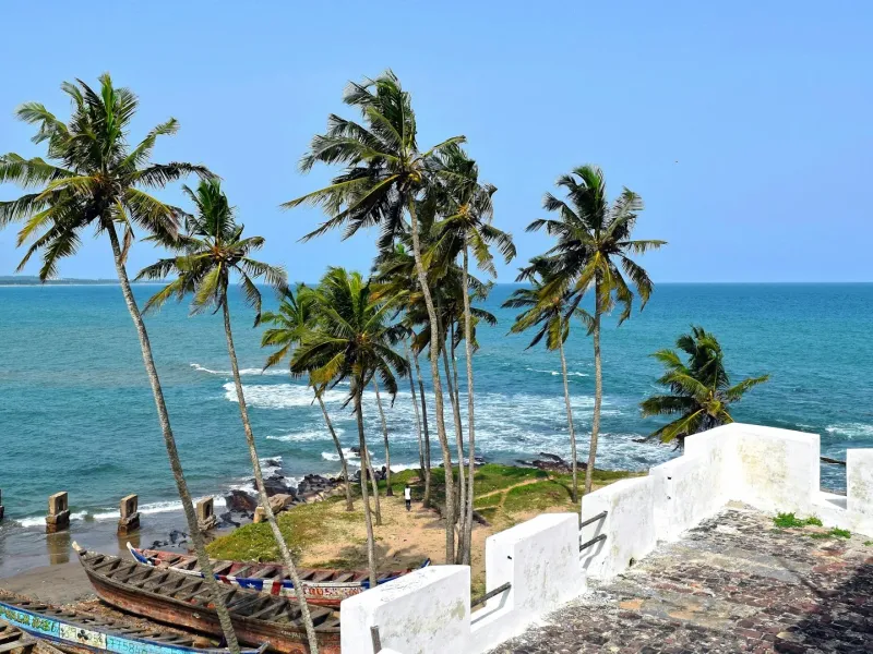 Elmina Castle in Ghana overlooking the Atlantic Ocean, a historic site on Ghana heritage tours and African diaspora travel jo