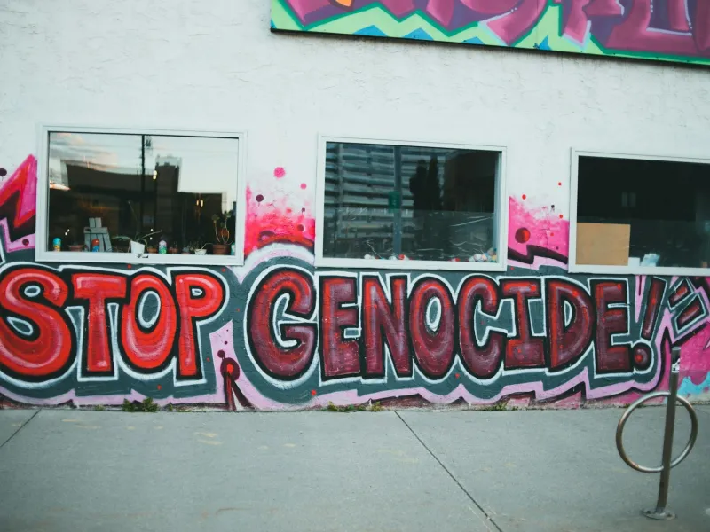 Graffiti painting of stop genocide in rwanda for a destination guide