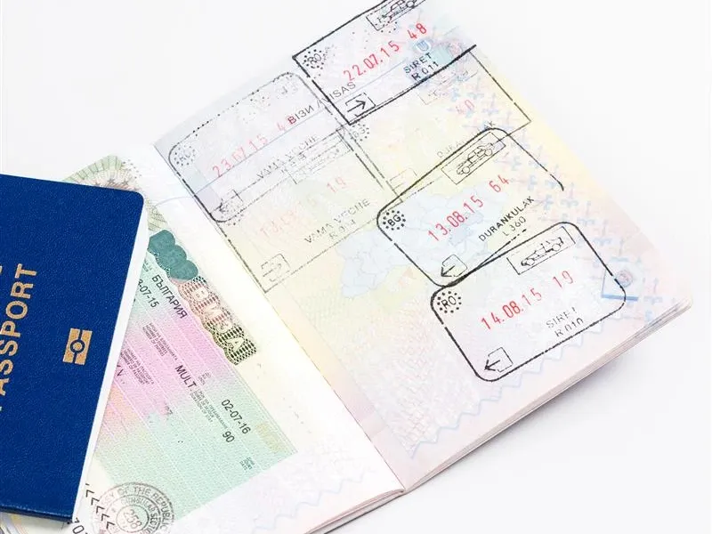a passport with pages with visas and stamps