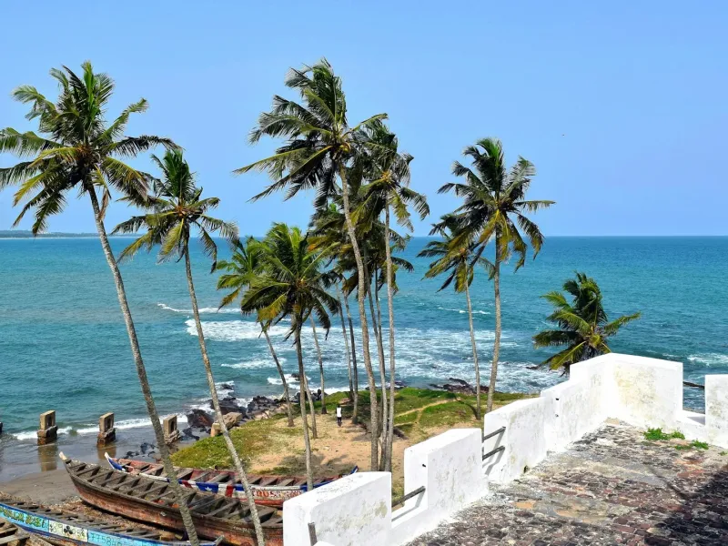 A scenic view of Elmina Castle in Ghana for a destination guide