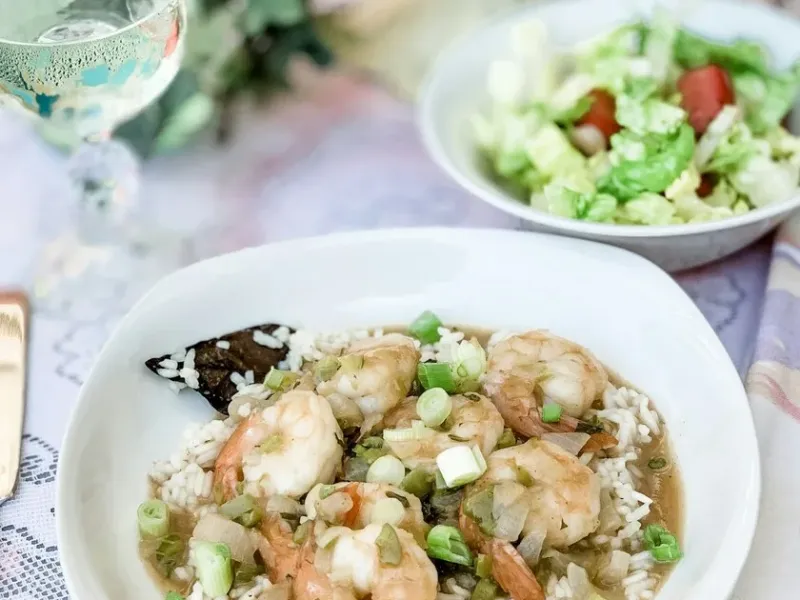 A bowl of Louisiana Creole shrimp served over rice, a classic New Orleans dish