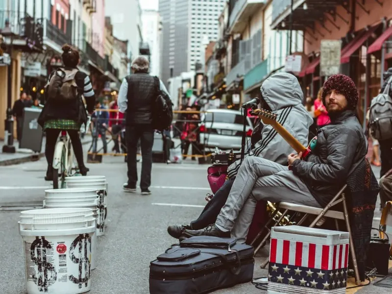 Street musicians performing live jazz with brass instruments on Frenchmen Street in New Orleans