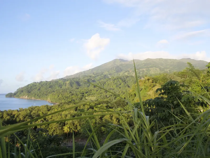 The broad forested mass of La Soufrière rising above the Leeward coast of Saint Vincent.