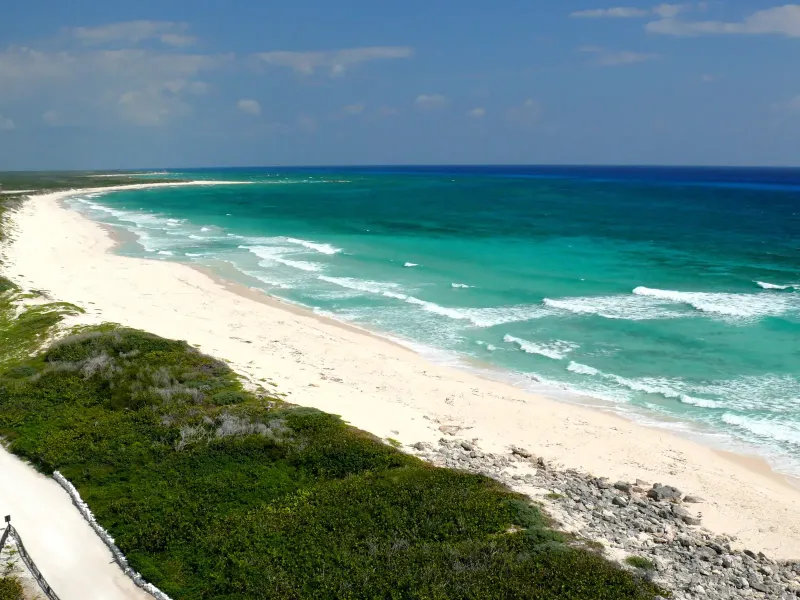 The undeveloped windward beach curving north from Punta Sur on Cozumel.