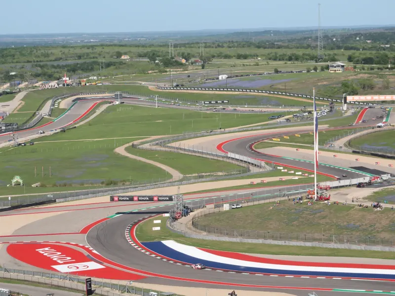 Red, white and blue curbing sweeps through the winding turns of the Circuit of the Americas track outside Austin.