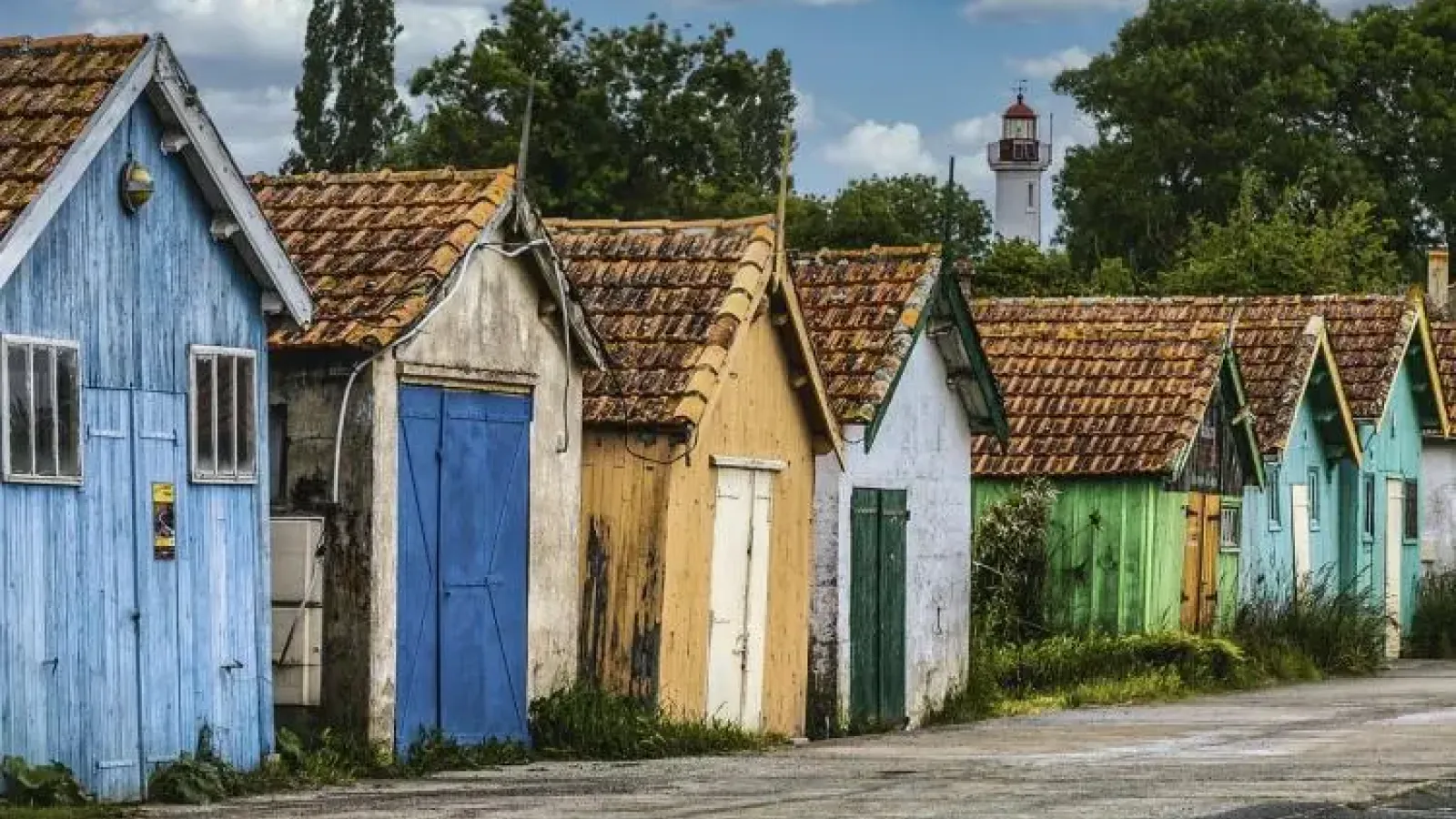 Colorful fishing huts in France featured