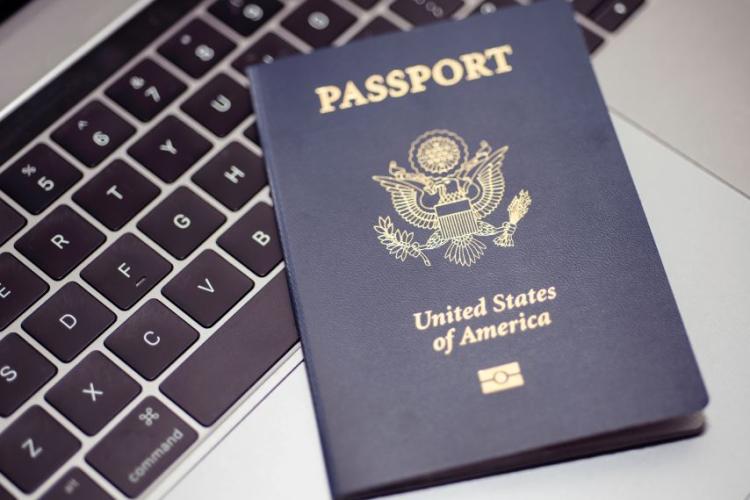 Passport on top of a keyboard