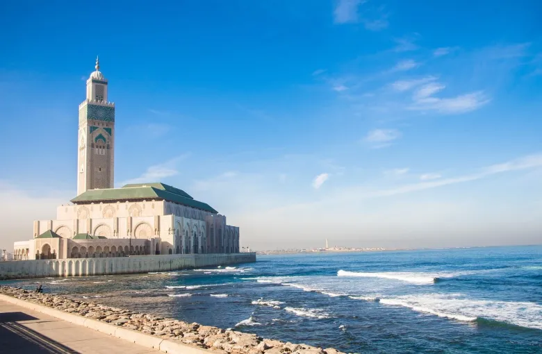The Hassan II Mosque and its minaret standing on the Atlantic shore at Casablanca.