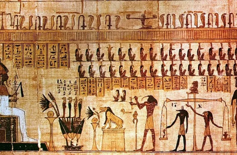 Ancient Egyptian hieroglyphs and historical carvings on a temple wall, representing Egypt's rich pharaonic heritage