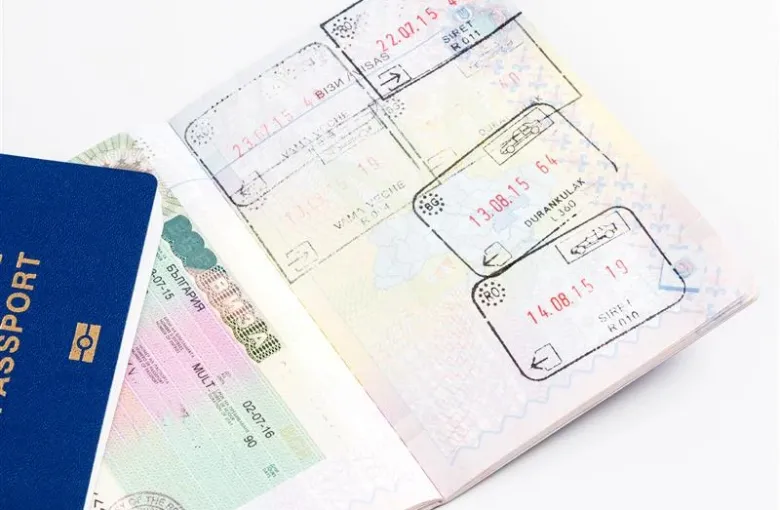 a passport with pages with visas and stamps