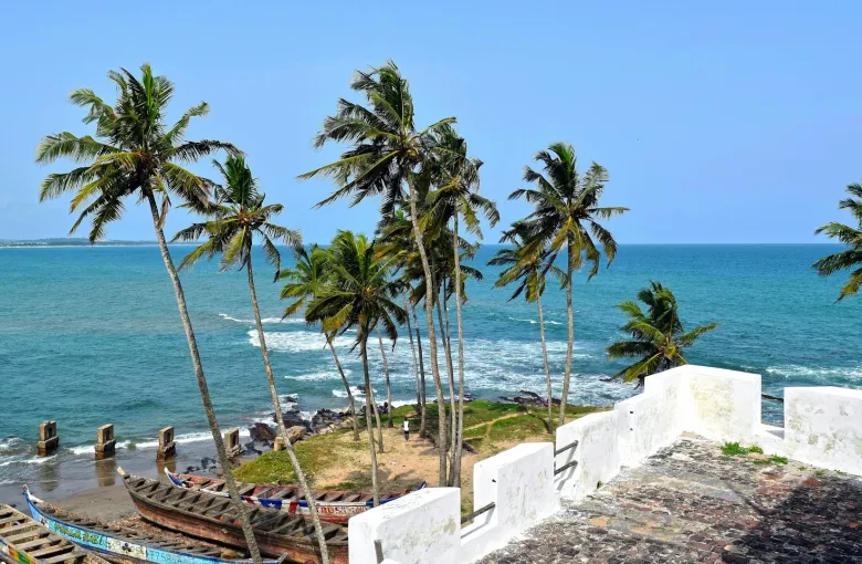 A scenic view of Elmina Castle in Ghana for a destination guide