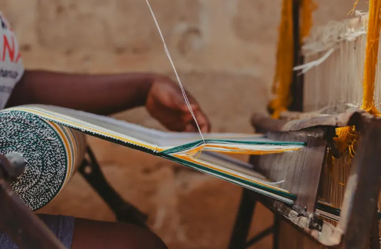 Traditional Kente weaving in Kumasi, Ghana, representing Ashanti culture and heritage on Ghana cultural tours