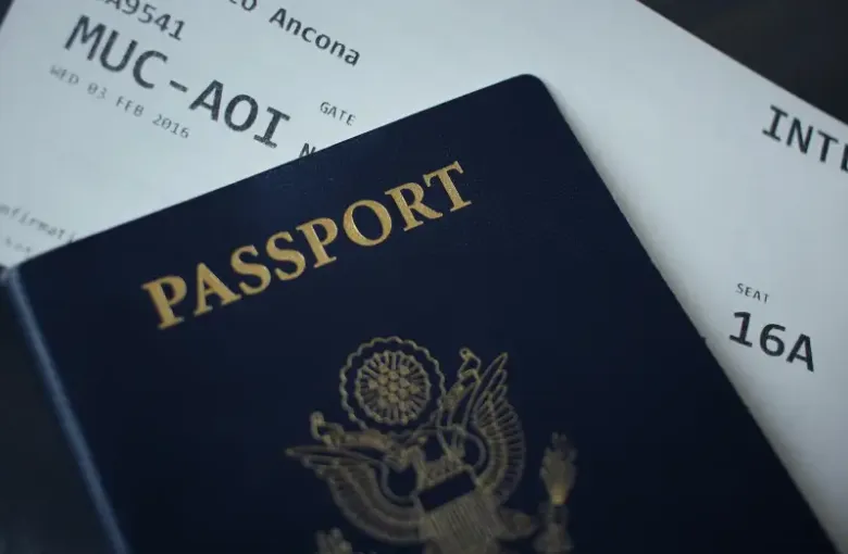 US passport and international boarding pass for flight MUC-AOI; seat 16A; supporting government travel-support document ma...