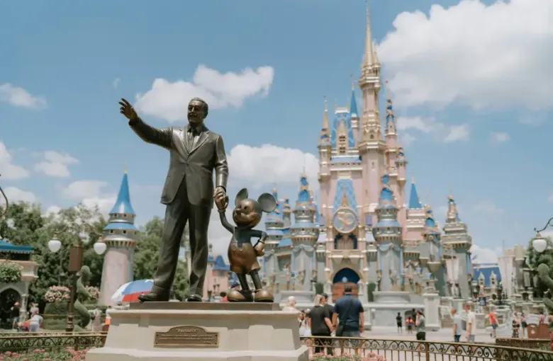 Partners statue of Walt Disney and Mickey Mouse with Cinderella Castle at Magic Kingdom; Orlando FL.