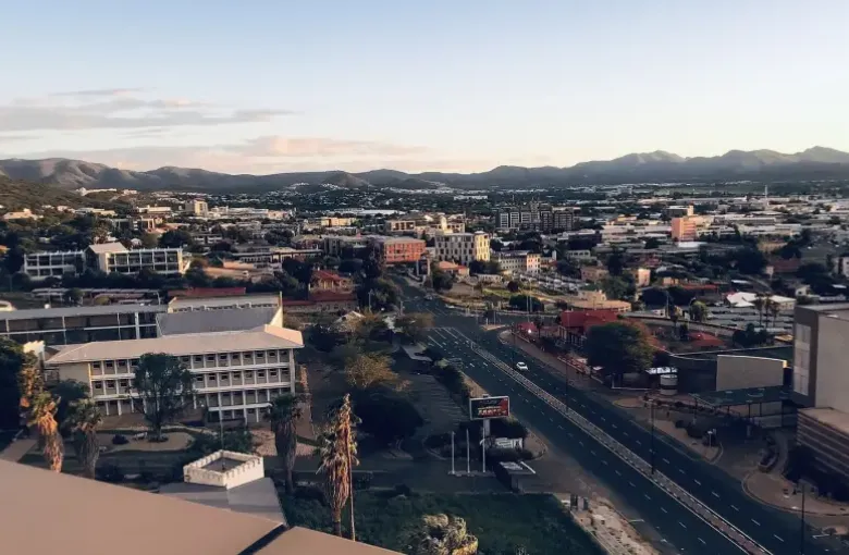 A view across the center of Windhoek with its main road and the surrounding hills.