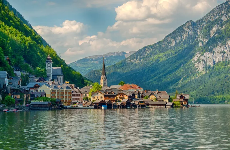 The village of Hallstatt packed onto the shore between the Hallstatter See and the wooded slopes of the Salzkammergut.