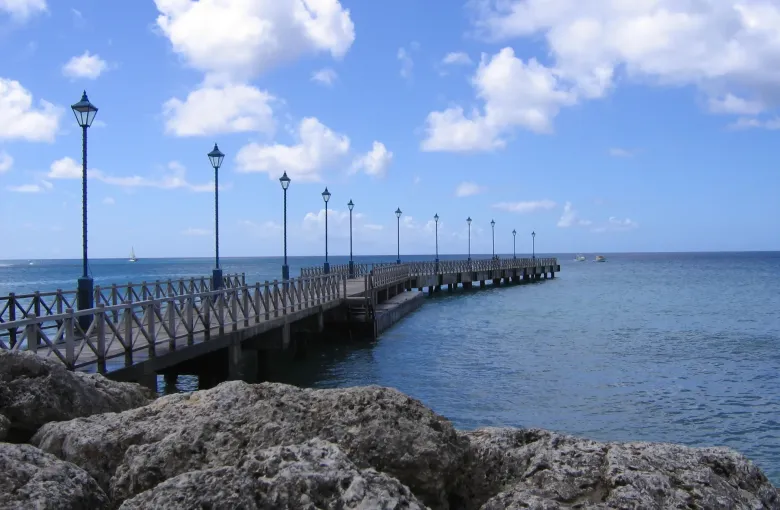 The level timber boardwalk running beside the sea at Speightstown in Saint Peter, Barbados.