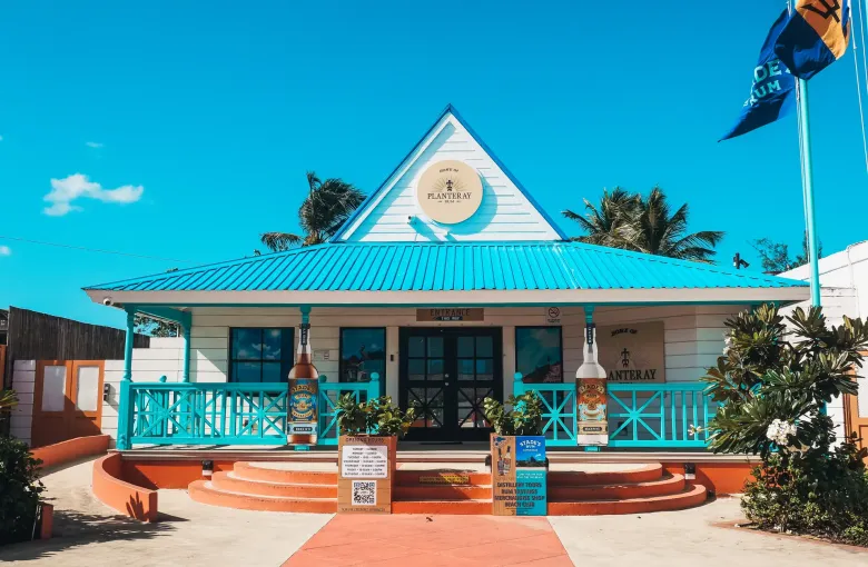 The turquoise visitor center of the West Indies Rum Distillery in Barbados.