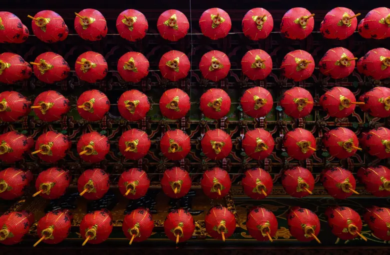 Rows of red paper lanterns hanging in the Kek Lok Si temple in Penang, Malaysia.