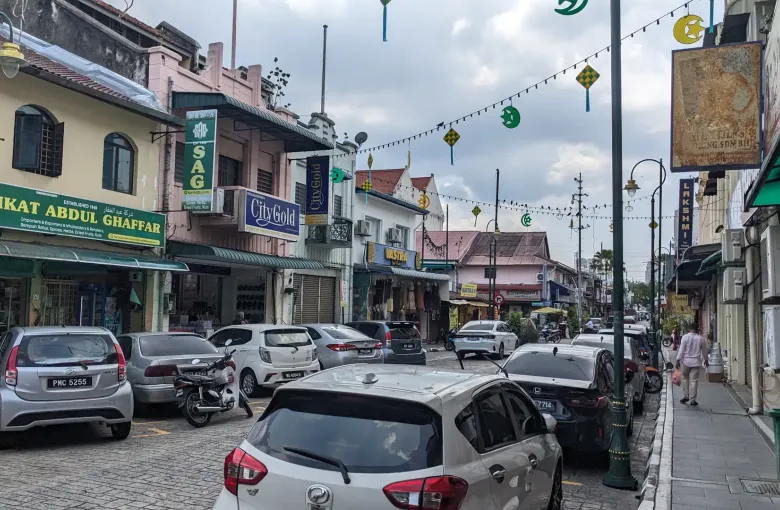 Shophouses and festive decorations along a street in Little India, George Town, Penang.