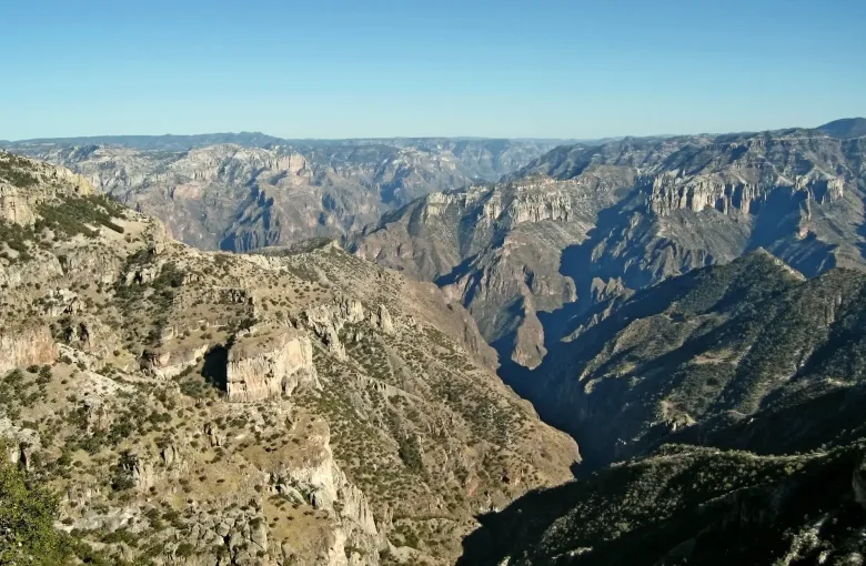 The Barranca del Cobre in Chihuahua, a dry canyon system falling away in ridges to a distant gorge floor.