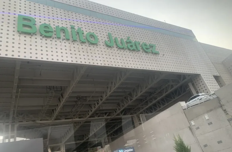 The lettered frontage of Terminal 2 at Benito Juarez International Airport in Mexico City above the departures entrance.