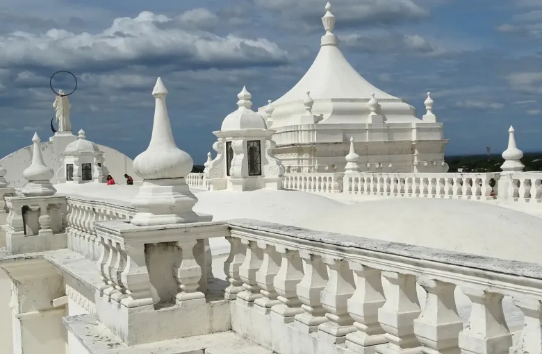 Whitewashed domes, balustrades and finials cover the broad walkable roof of Leon Cathedral.