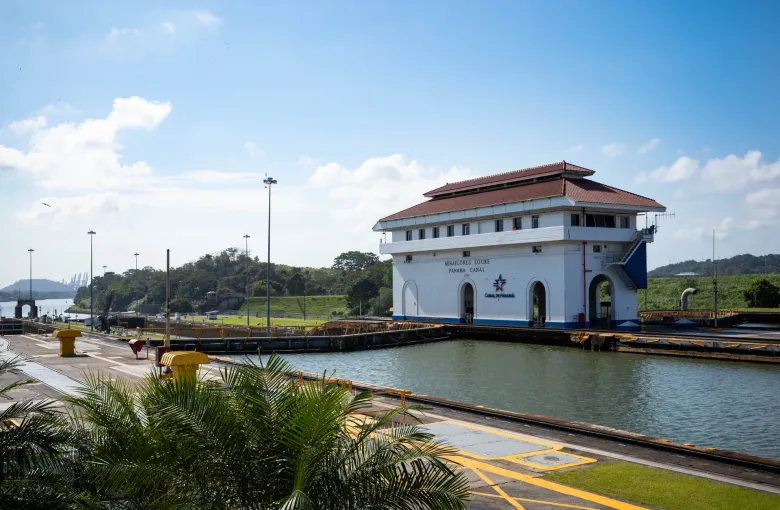 The control house and empty lock chamber at Miraflores on the Panama Canal, seen from the bank.